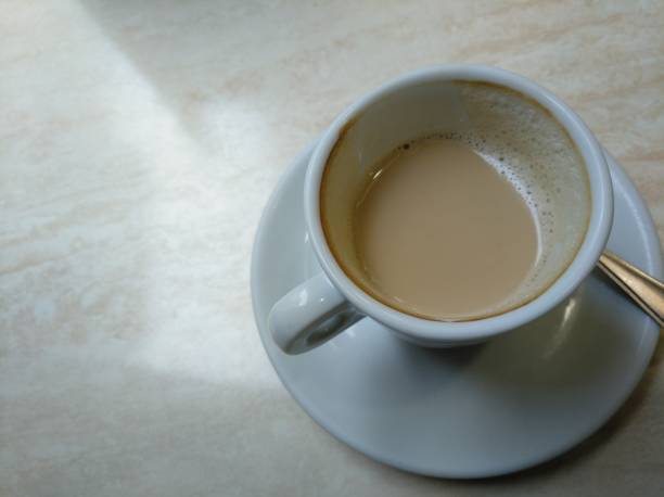 istock Having a cup of coffee with milk. 1185199881