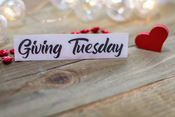Giving Tuesday donate charity concept on wooden board stock photo