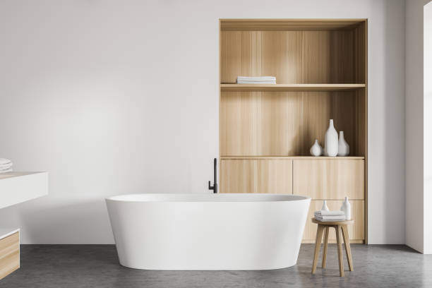 istock White bathroom interior with tub and cabinet 1185200606