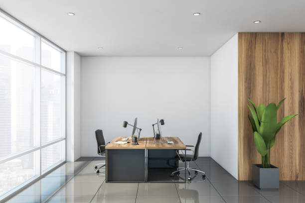 istock Workspace in modern white and wooden office 1185200729