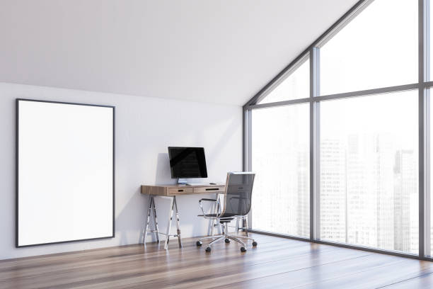 istock White attic home office corner with poster 1185202551