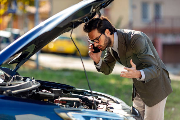 istock Man standing near broken car and calling 1185203351