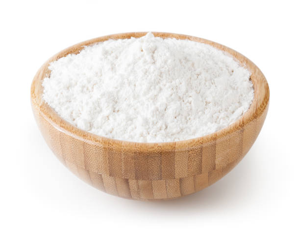 istock Wheat flour in wooden bowl isolated on white background with clipping path 1185203356