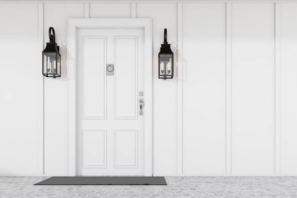 istock White front door of white house with mat 1185203391