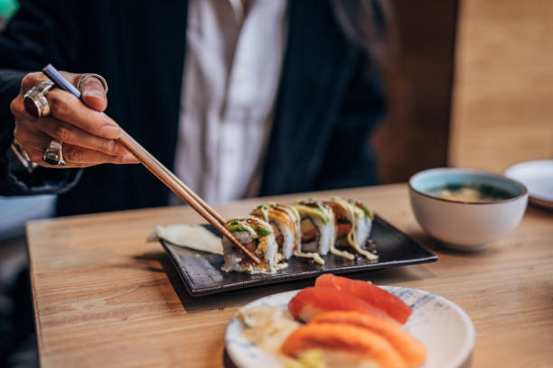 istock Mature man  in sushi bar 1185203649