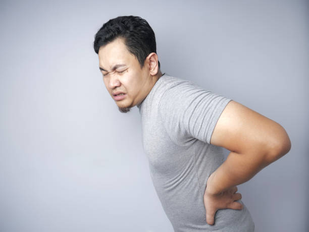 istock Young Man Suffers From Lower Back Pain 1185203703