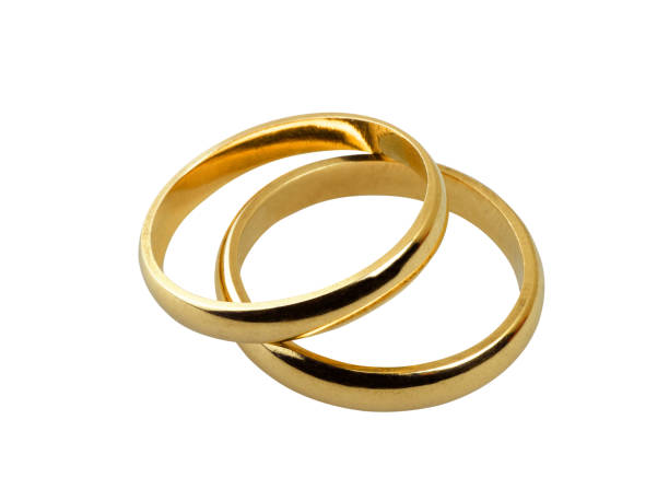 istock Old wedding rings together isolated on white 1185204877