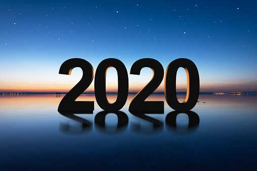 2020 new year concept with silhouette on the salt lake against sunset.