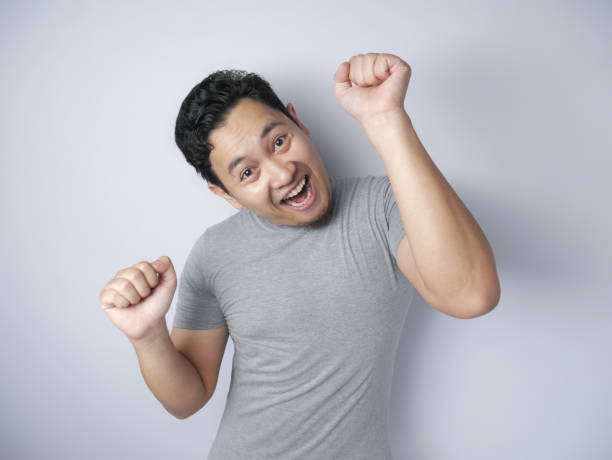 istock Happy Funny Asian Man Dancing Full of Joy 1185206443
