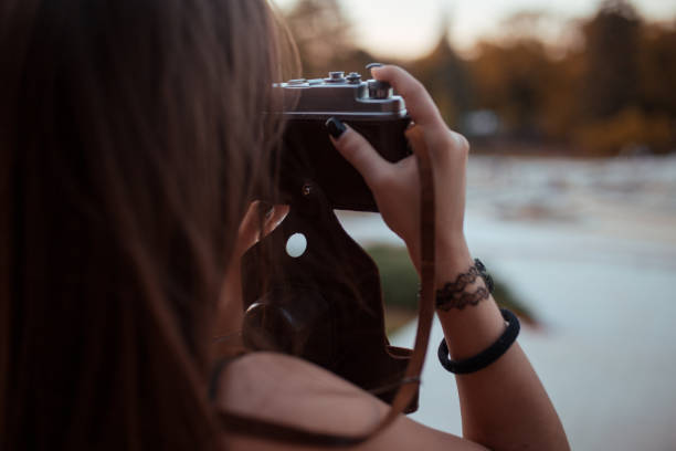 istock Young woman tourist with camera 1185206457