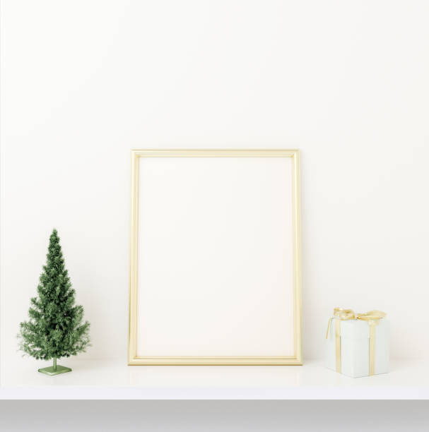 istock Interior mock up golden frame design with small chrismas tree and present on white concrete background. 3D rendering, illustration. 1185209225