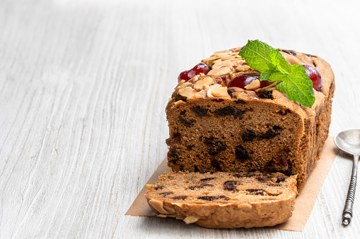 Mixed  fruit loaf cake on wooden table