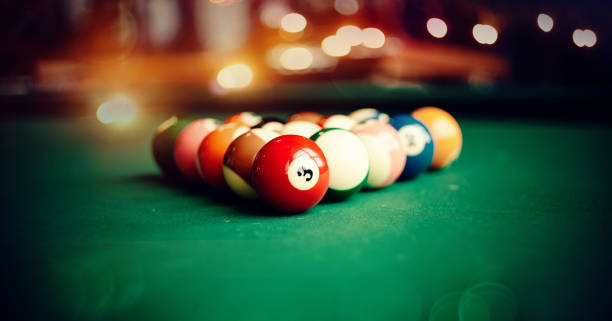 istock Colorful billiard balls on a green billiard table. 1185210718