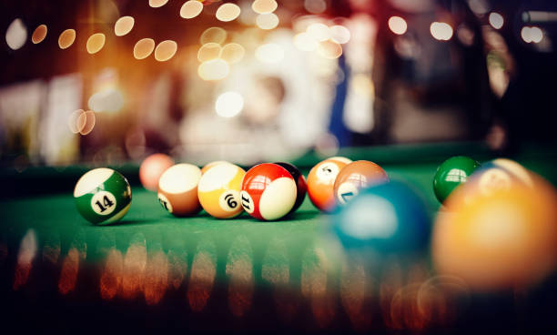 istock Colorful billiard balls on a green billiard table. 1185211316