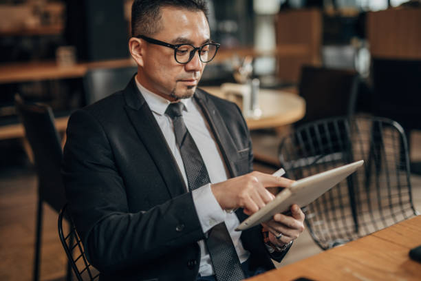 istock Businessman with digital tablet 1185211636