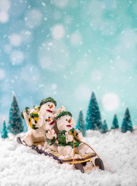 istock Winter scene of Sledding Snowmen 1185211730