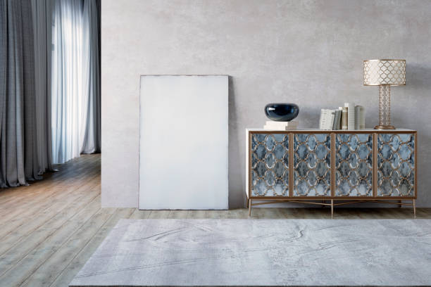istock Empty interior with a blank canvas, a stand, a light wall, and wooden floor. 1185212578