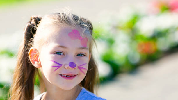 istock Cute girl with a pattern on her face. 1185213330