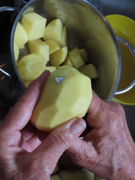 istock Woman Chopping a Potatoes 1185213671