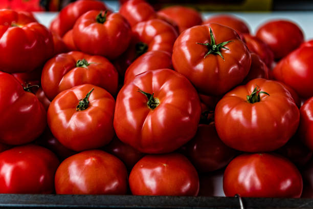 Fresh tomatoes on a bowl,closeup shot with isolated background.