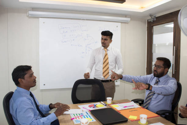 istock Business team arguing at office meeting 1185216248