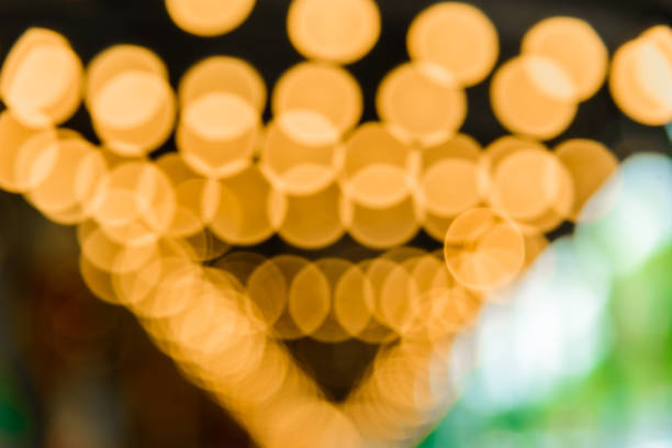 Rows of illuminated globes under the marquee as is often used at the entrance to theatres and casinos