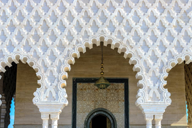 view of part of the facade of the mausoleum of mohammed v against the blue sky. rabat, morocco - urban scene real estate nobody white imagens e fotografias de stock