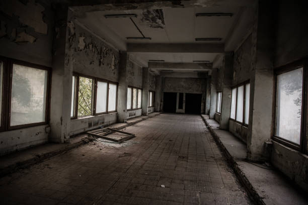 istock Dark, spooky tunnel, corridor with large windows at the end in abandoned building 1185219411