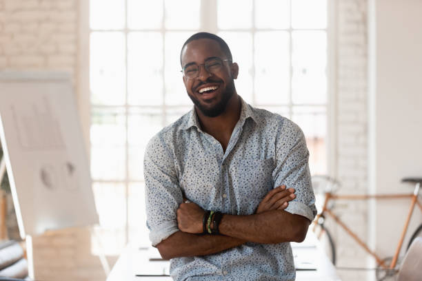 istock Young joyful mixed race male manager having fun. 1185220704
