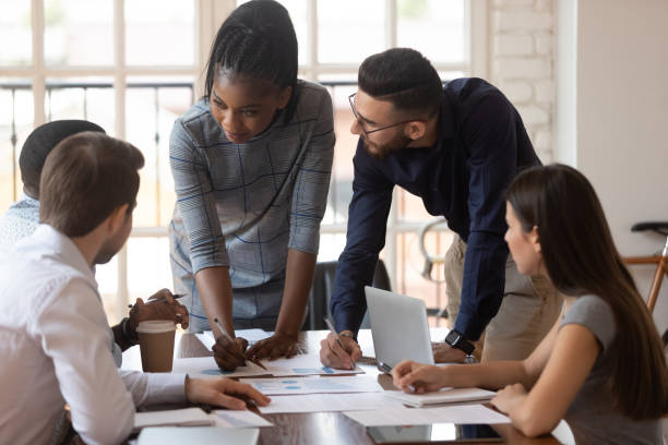 istock Diverse group of managers working together at office. 1185220732