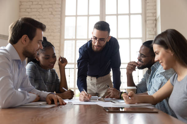 istock Engaged arabic male team leader discussing project ideas with partners. 1185220734