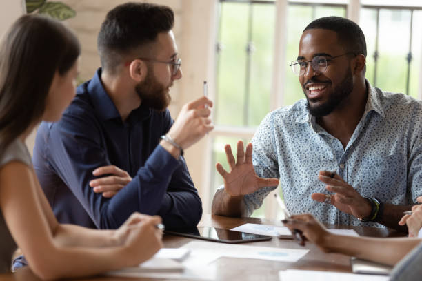 istock Motivated engaged young african american manager sharing new project ideas. 1185220743