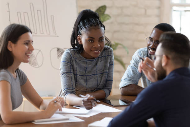 istock Successful mixed race group of managers working together at office. 1185220748