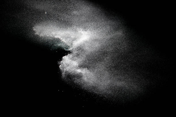 istock Bizarre forms of white powder explosion cloud against black background.White dust particles splash. 1185221132