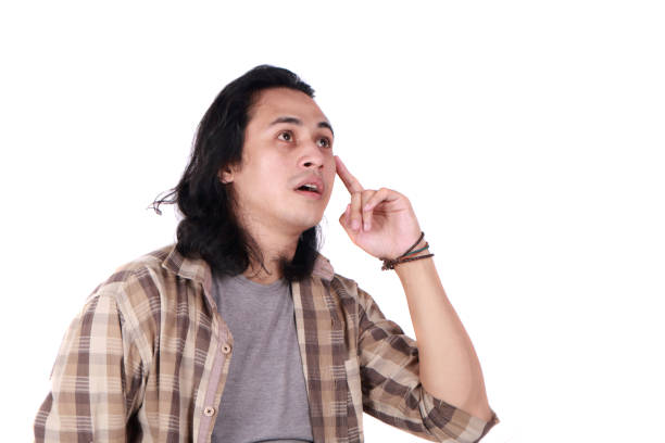 Young asian men thinking gesture, eyes glance to the top, finger touch forehead, side view
