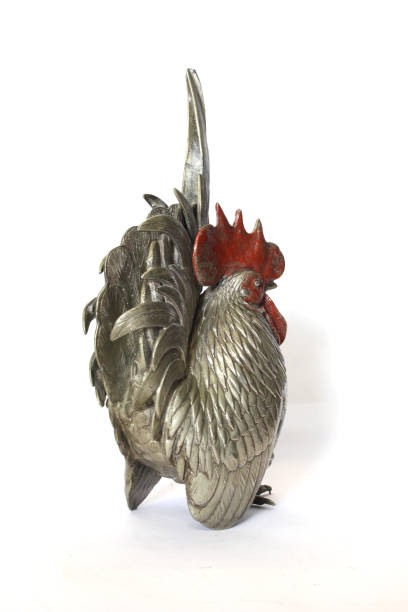 istock A Silver Metal Cockerel Chicken Decoration Figure on White Background 1185222415