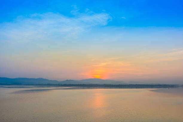 istock blue sky and sunrise with mountain background in morning time 1185222586