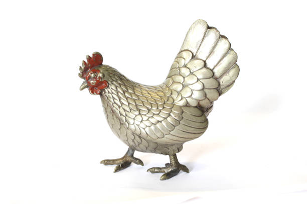istock A Silver Metal Cockerel Chicken Decoration Figure on White Background 1185222594