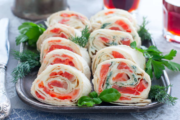 istock Lavash roll with red fish and cheese on a metal dish, horizontal 1185224766