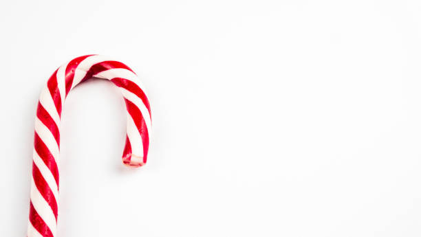 istock Christmas candy cane on a white background. Flat lay, top view, copy space 1185224926