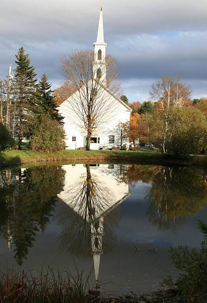 istock Mirror Reflection and Fall Colors, Newfane church, Vermont, USA 118522930