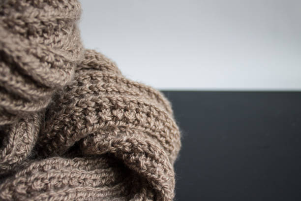 istock knitted scarf on black and white background 1185230434