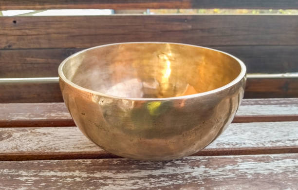 istock Tibetan singing bowl with wooden background 1185230516