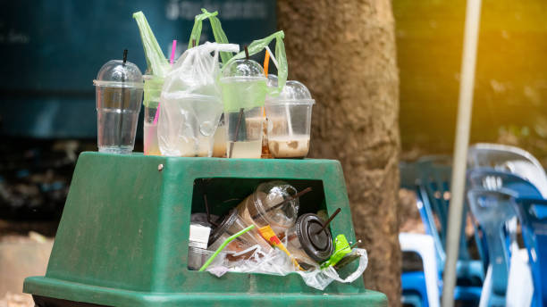 istock Green trash can, filled with plastic waste 1185231812
