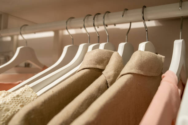 istock Natural Materials Dresses on wooden hangers Close Up 1185232183