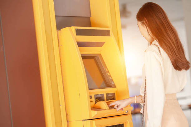 istock Press ATM EPP keyboard, Security code on an Automated Teller Machine. Female arms, ATM - entering pin 1185233292