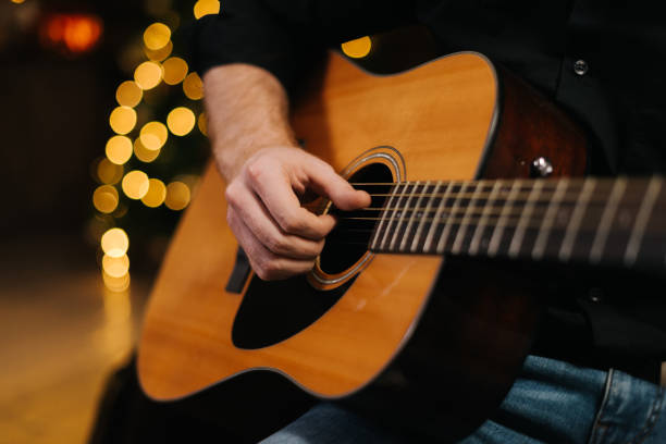 istock Man plays guitar close-up. 1185234695