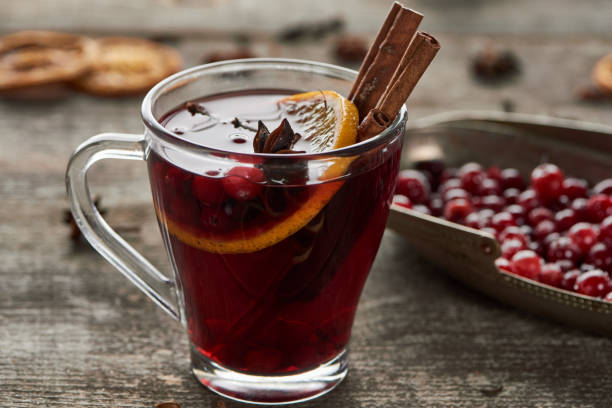istock red spiced mulled wine with berries, anise, orange slice and cinnamon on wooden rustic table 1185235040