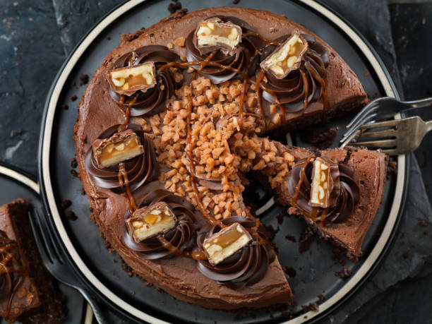 istock Caramel, Butter Toffee Crunch Chocolate Cake with Candy Bar Pieces 1185235224