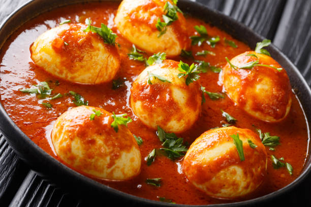 istock Curry egg recipe in spicy sauce close-up in a plate. horizontal 1185235879